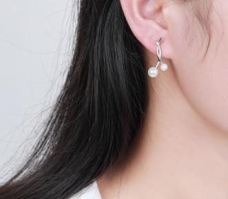 Boucles d'oreilles élégantes en argent sterling 925 avec perles entrelacées